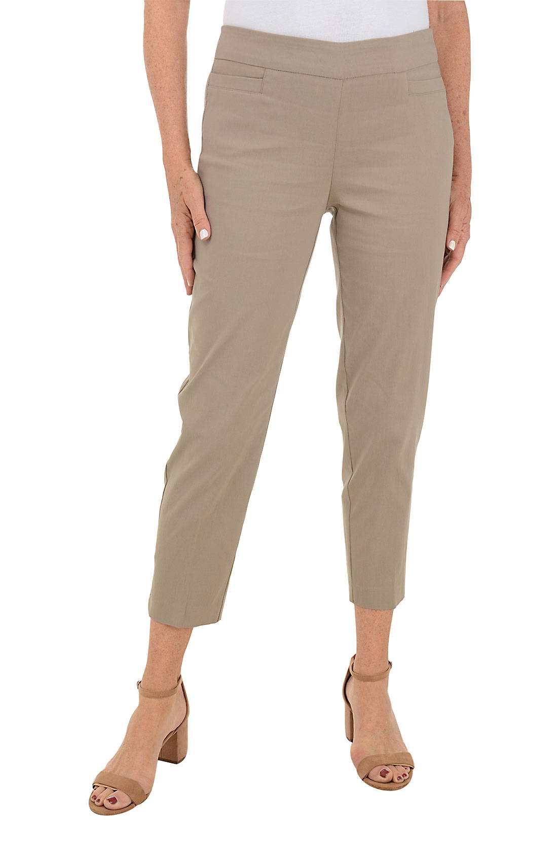 A woman wears an ankle-length khaki pant against a white background