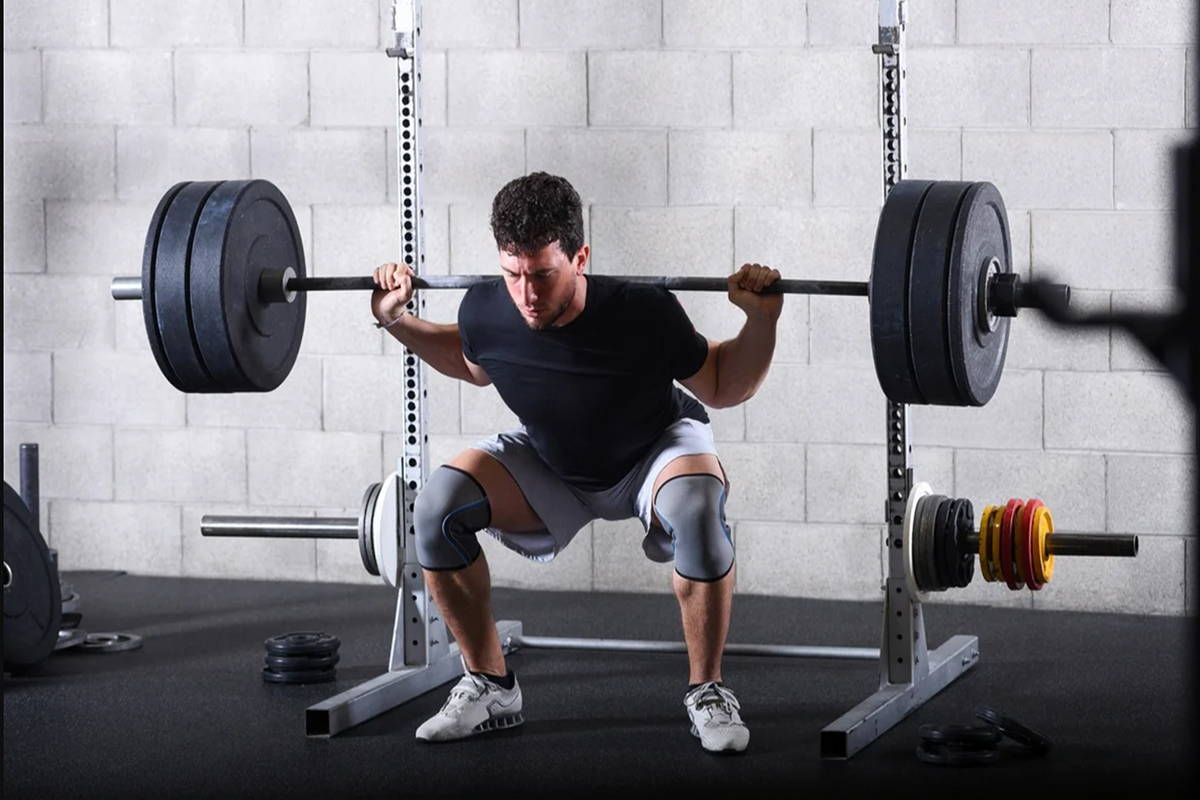 athlete deadlifting in gym