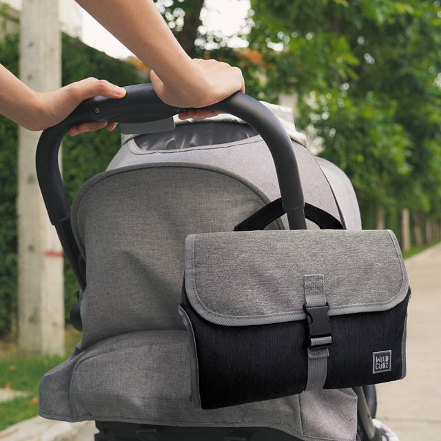 Portable diaper changing pad attached to baby stroller