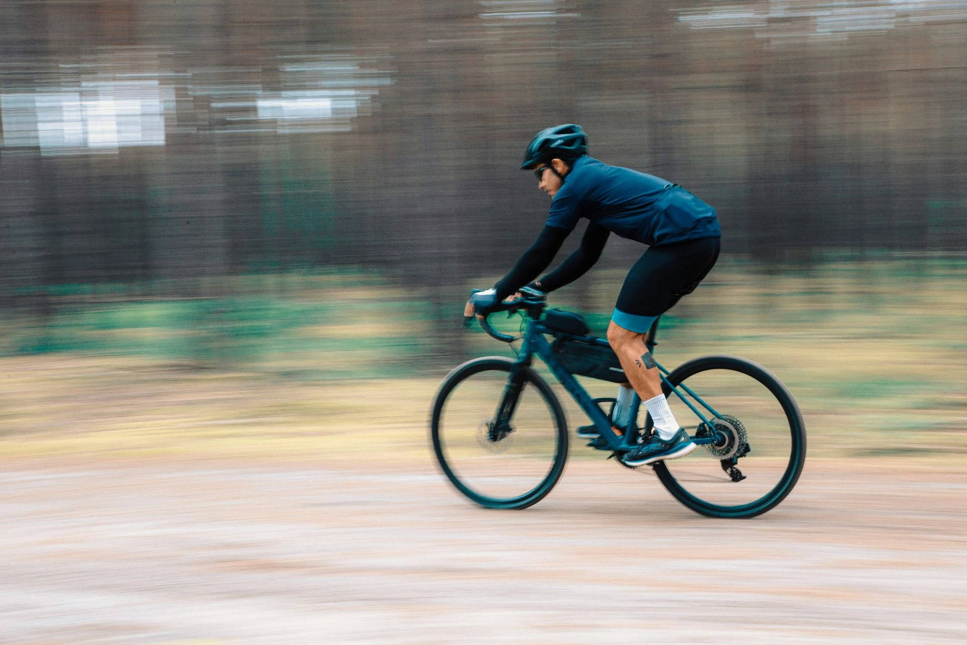 Cyclist at high speed on his electric gravel bike. 