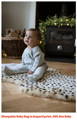 Baby sat on leopard print luxury sheepskin Baa Baby rug