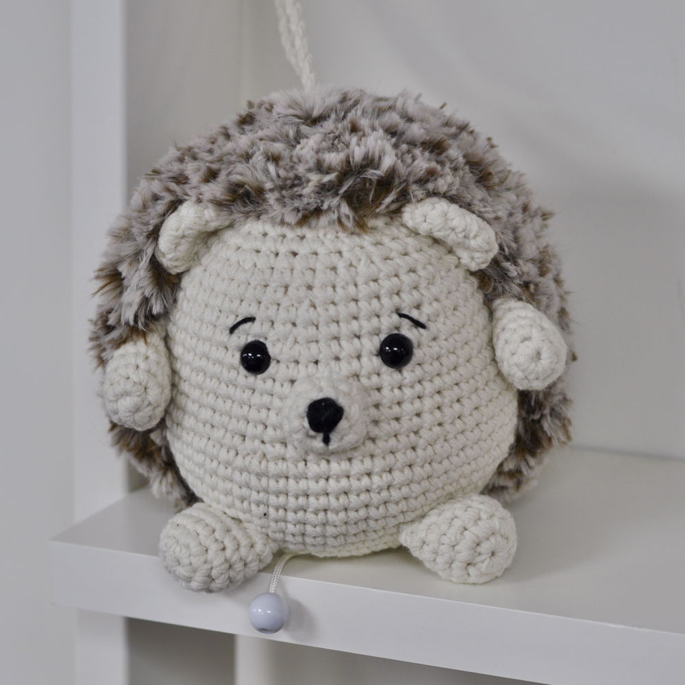 Hedgehog cuddly toy with music box