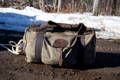 a summit pack sitting on a lawn chair on a rocky beach