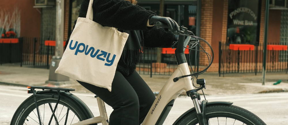 Rider with Upway tote bag on Specialized ebike in NYC