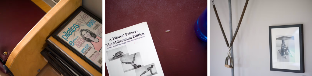Pilates magazines, a book titled 'A Pilates' Primer,' and a framed photo with Pilates equipment in a minimalist setting.