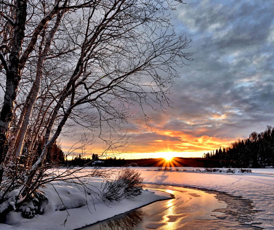 Winter Solstice sun over snowy river