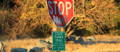 Stop sign and State Parks Trail electric bike sign