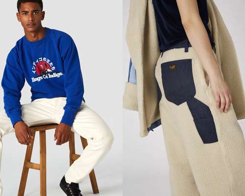 Man wearing Kings of Indigo organic cotton french navy sweatshirt with cream jeans and man wearing beige sherpa trousers