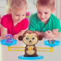 Boy and girl playing with the Montessori Monkey's Math learning game.
