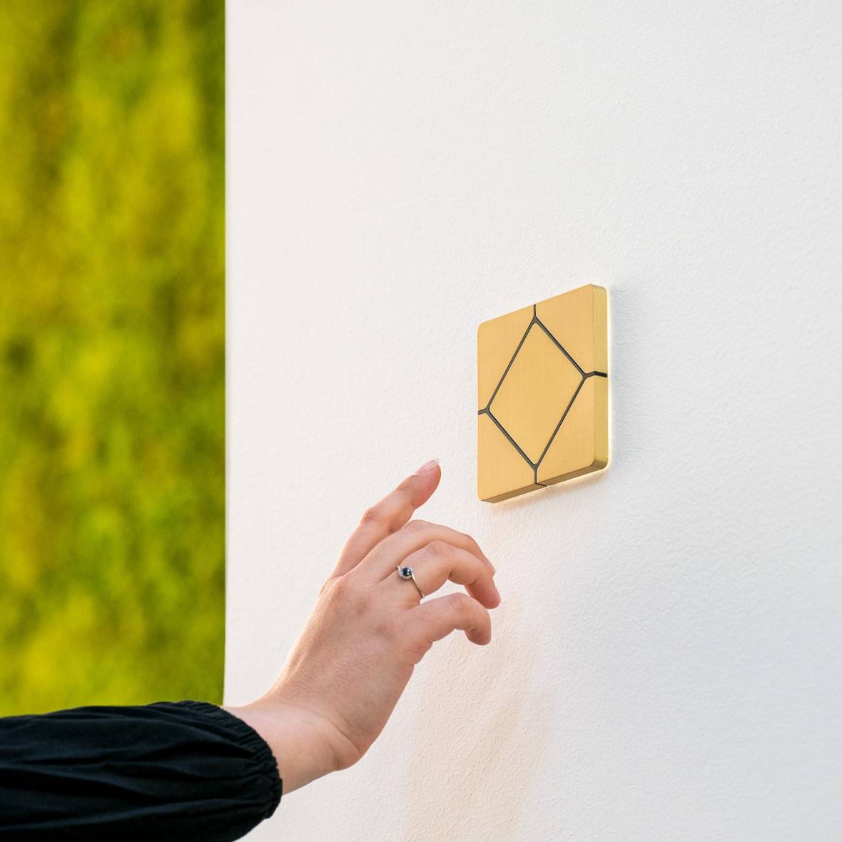 Faradite TAP-5 smart home light switch on decorative wall