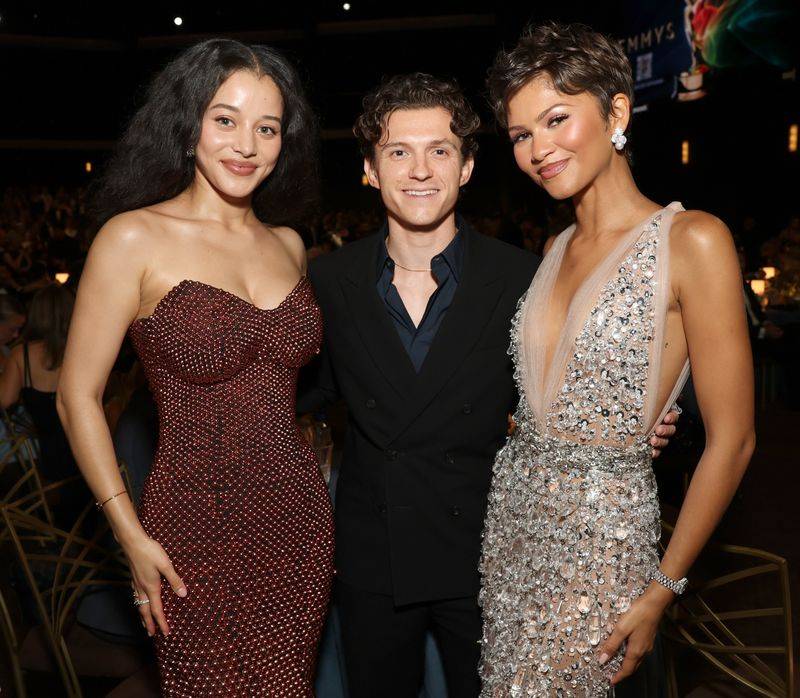 Image may contain: Zendaya, Tom Holland, Fashion, Adult, Person, Clothing, Dress, Wedding, Face, and Head