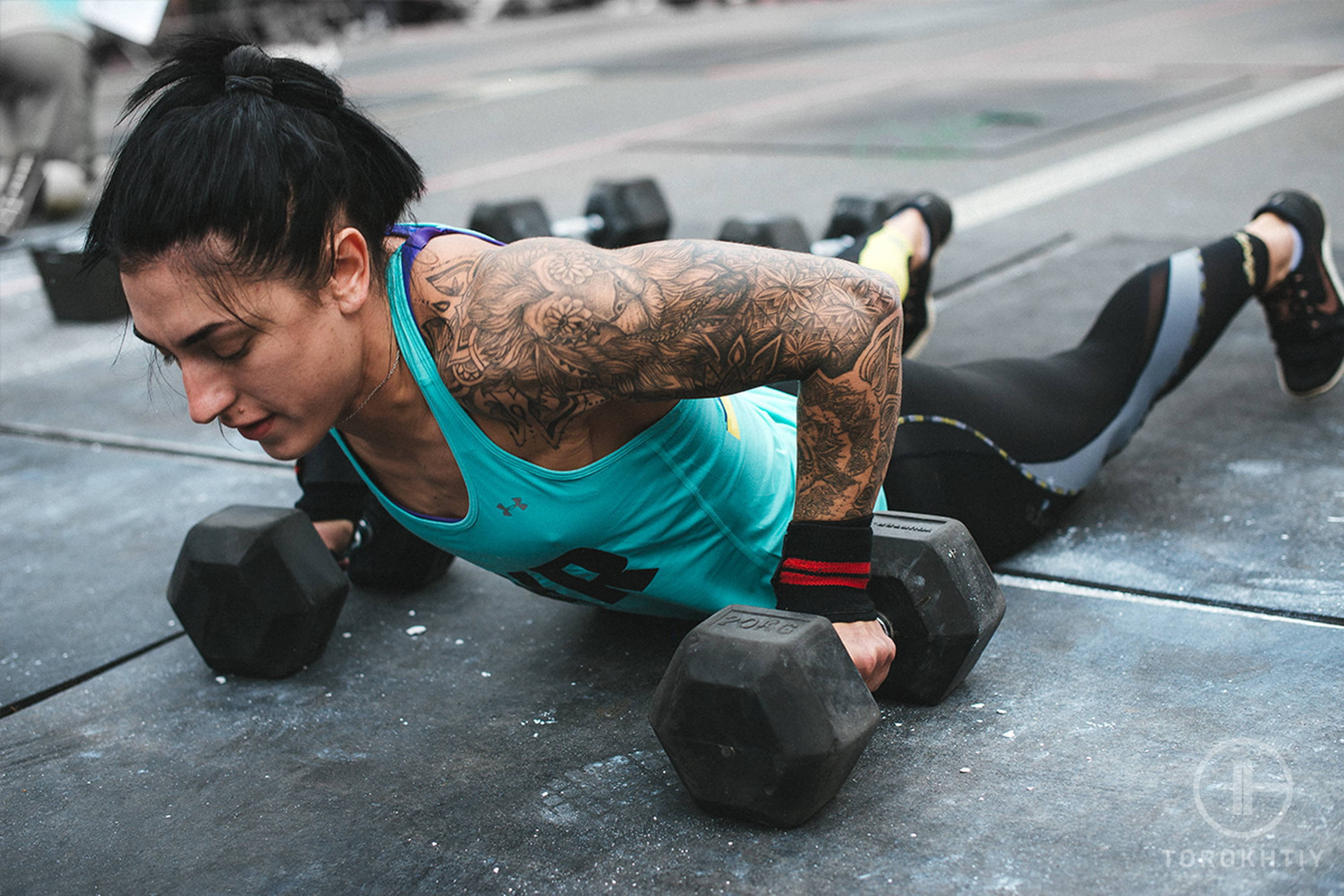 female athlete with dumbbells female athlete with dumbbells
