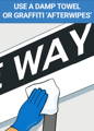 Wiping away residual graffiti from street sign after using Graffiti Safewipe