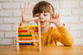Kid learning to count with a STEM toy