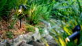 Havit garden spike lights illuminating landscaped planting bed