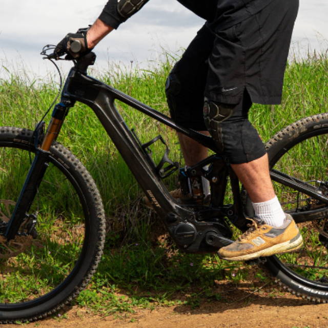 a man riding a Giant full suspension electric mountain bike