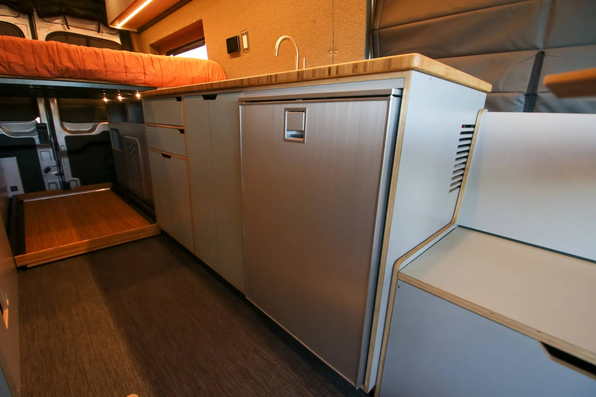 Kitchen Galley with Sink and Refrigerator in Ford Transit Camper Van Conversion by The Vansmith