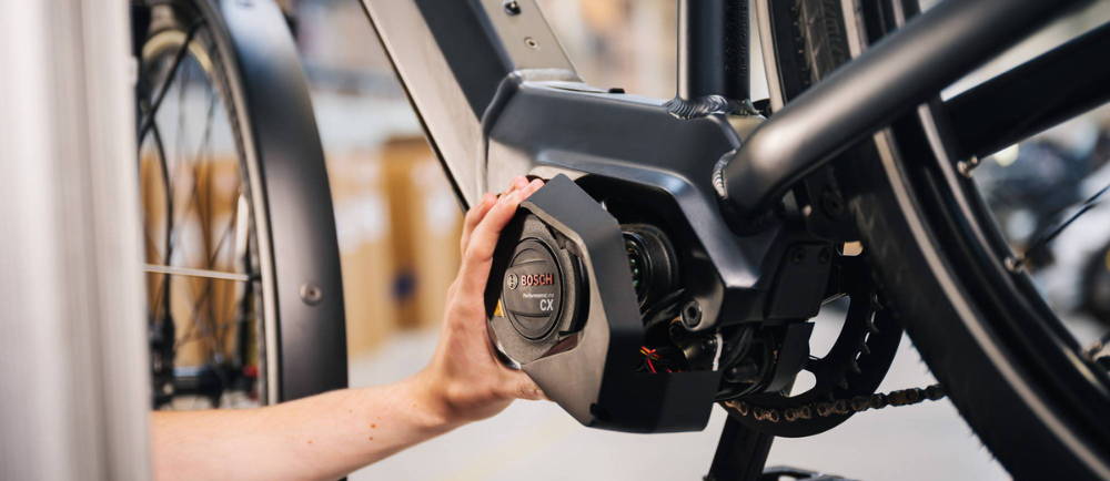 Technician working on an e-bike motor