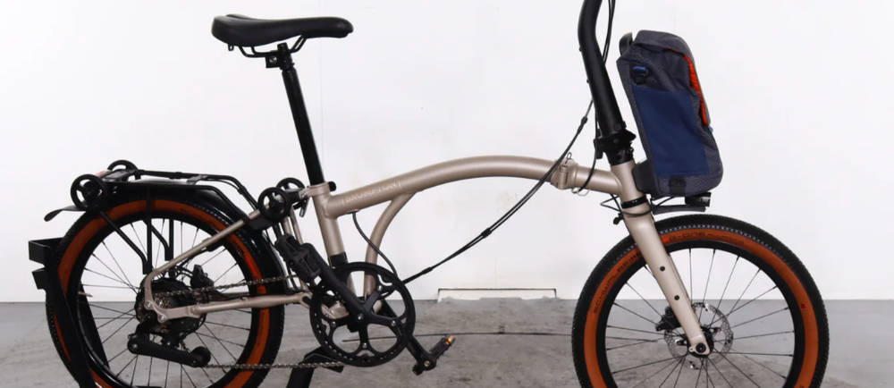 a gold Brompton Electric G Line electric folding bike