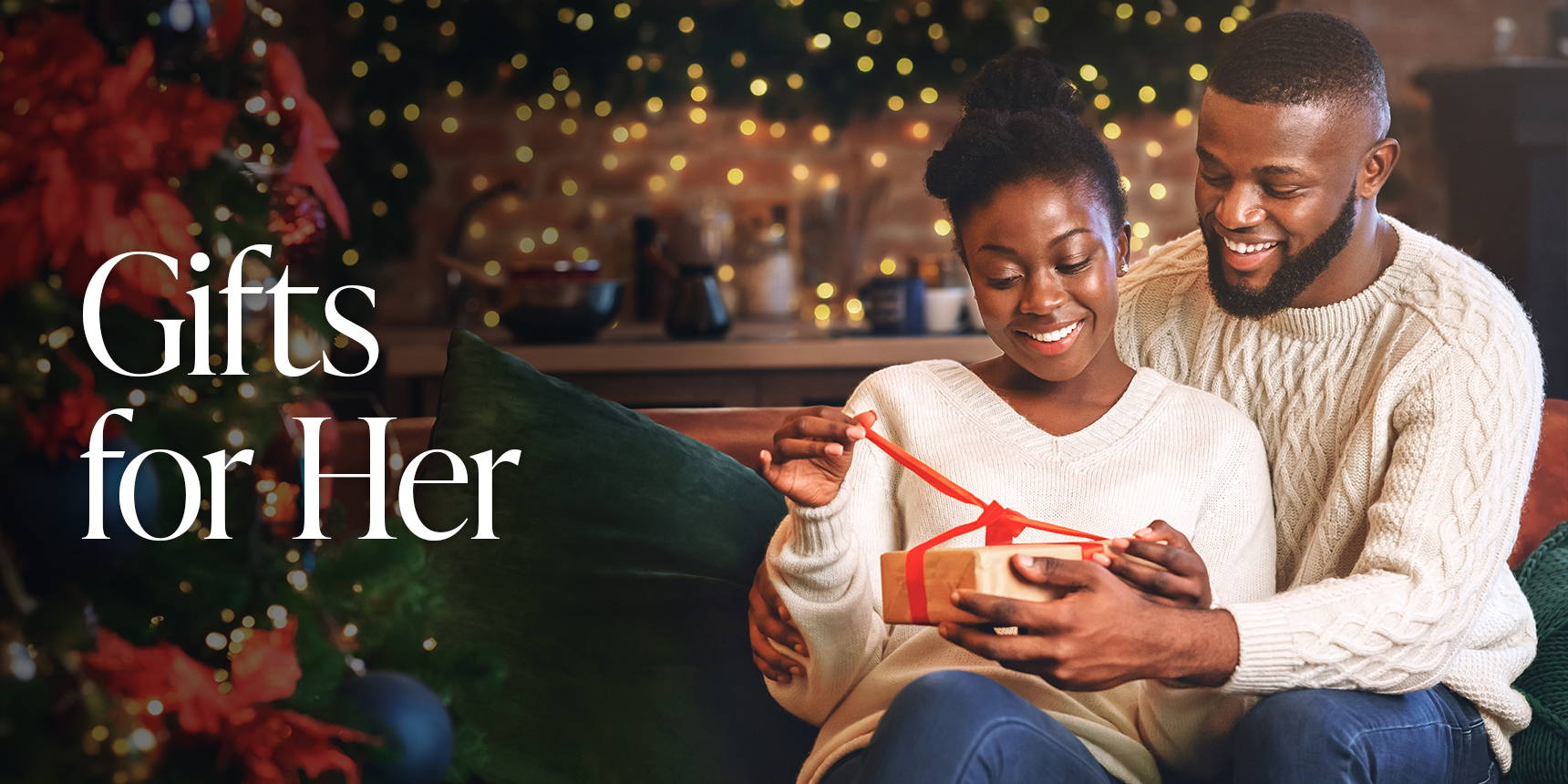 Women opening holiday gift - Shop Gift Ideas for Her