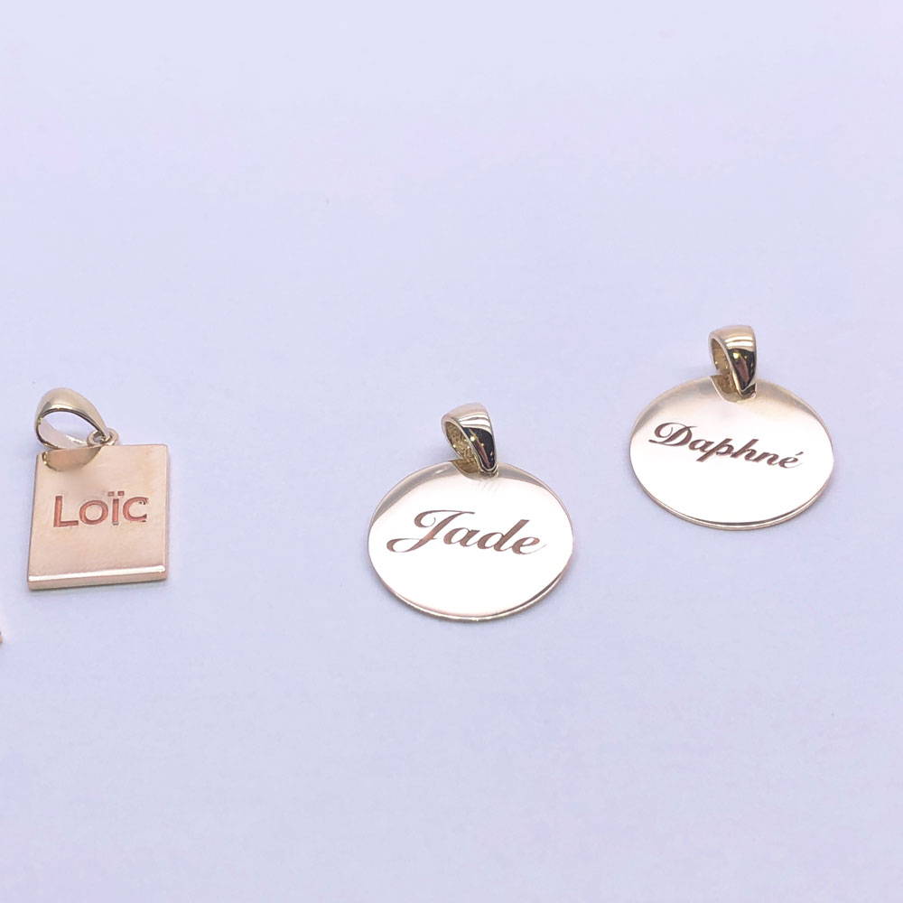 three pendants with the children's names