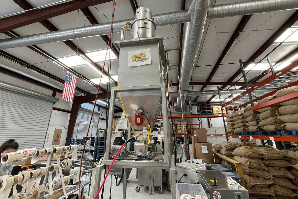 A weigh fill machine in a warehouse.