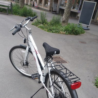 Bike with free helmet, lock, seat cover