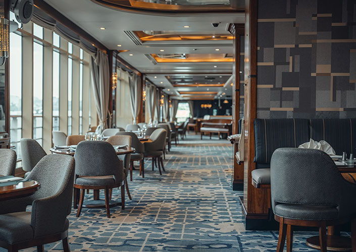 a restaurant on a cruise ship with a grey geometric IMO certified wallpaper and wallcovering suitable for marine projects