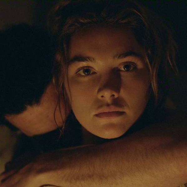 Florence Pugh being embraced from behind