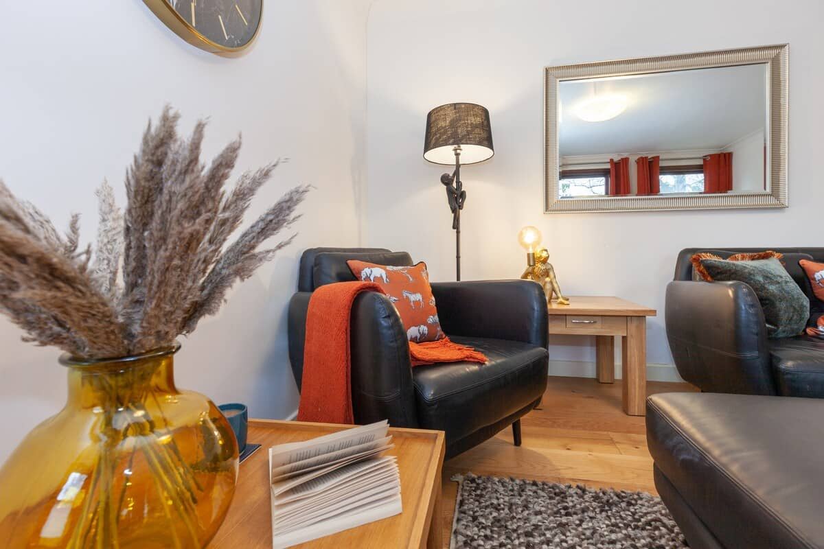Living room showing chair and table with floor lamp