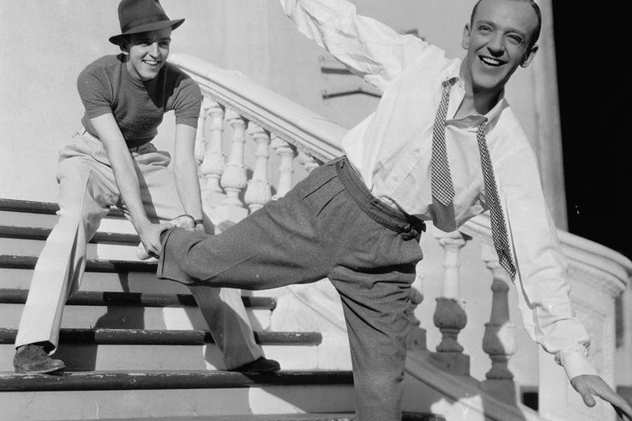 Image may contain: Fred Astaire, Fred Astaire, Architecture, Building, House, Housing, Staircase, Handrail, Adult, and Person