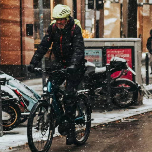 Rider on ebike in snowy street