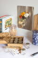 A set of magnetic jars are attached to a steel backsplash above a full set of boxed jars labeled Gneiss Spice