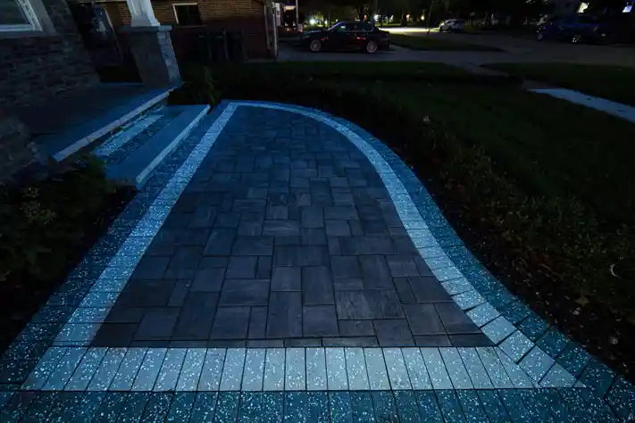Walkway made with Glow Path Pavers leading to a front entrance.