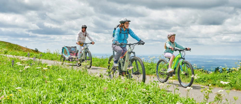 Familiy riding on electric bikes