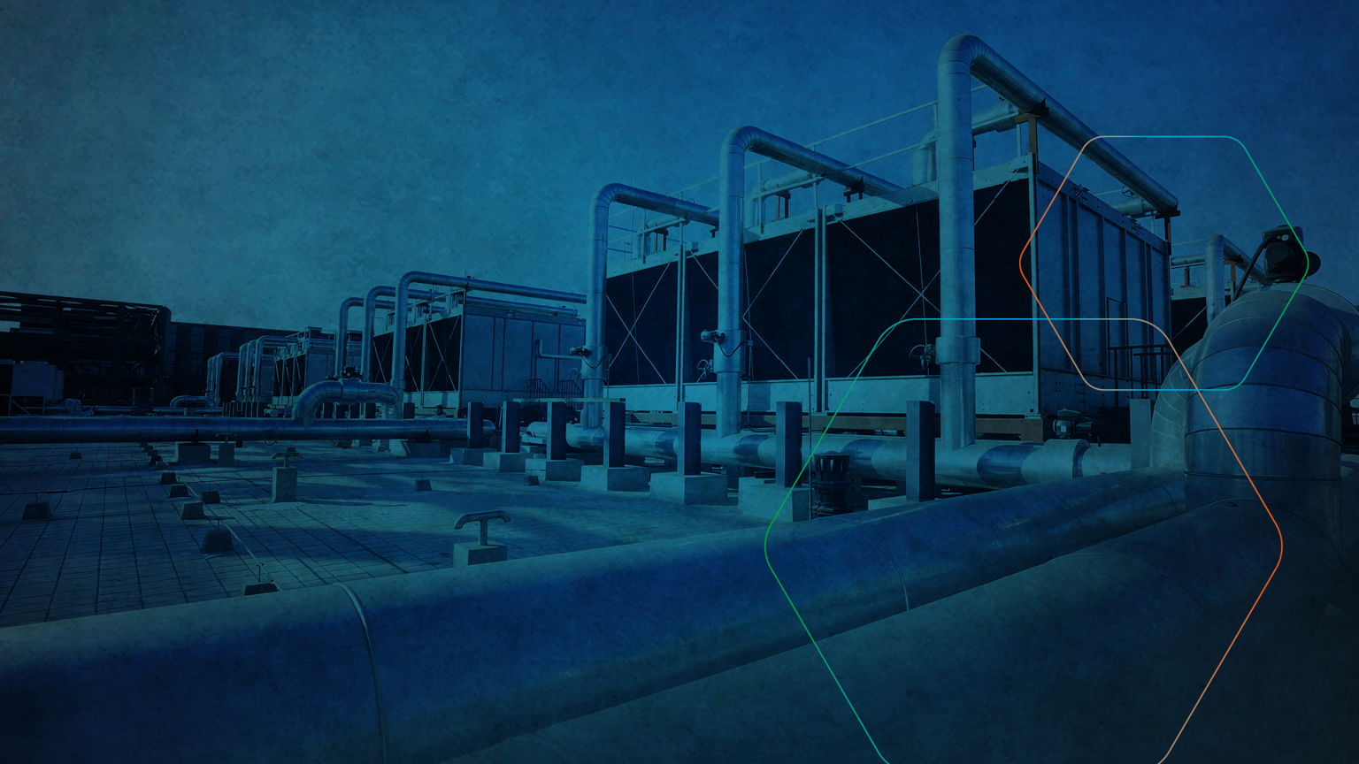 Outdoor view of industrial cooling units with interconnected pipes on a rooftop, under a clear sky. The scene is tinted blue, adding a cool tone. A faint geometric pattern overlays the image.