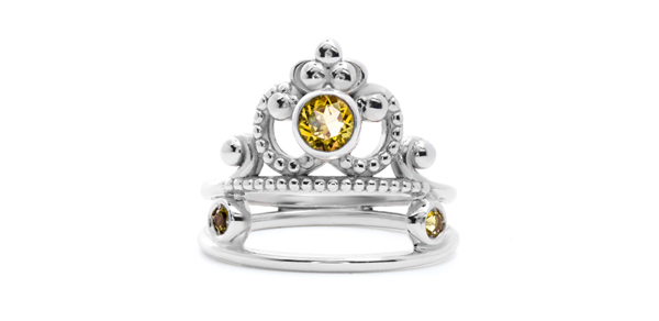 Thin-edged, regal-looking love ring in gold with round citrine.