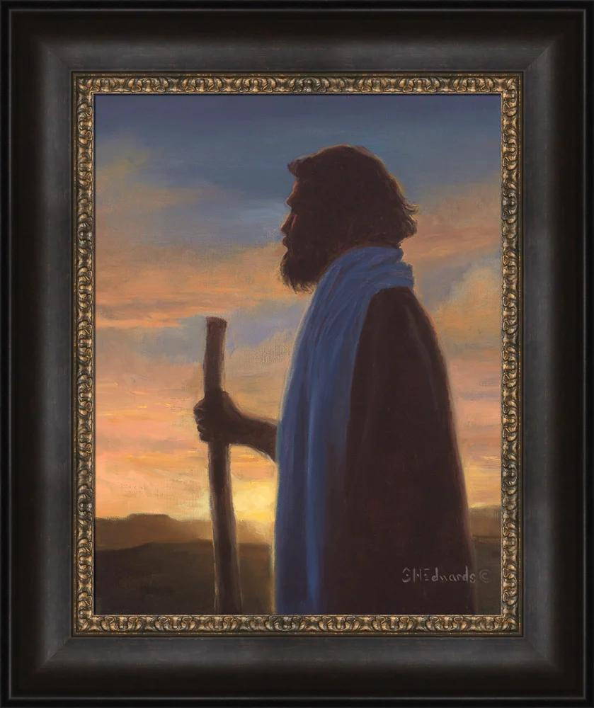 Framed painting of Jesus holding a staff and standing in the dimming sunset.