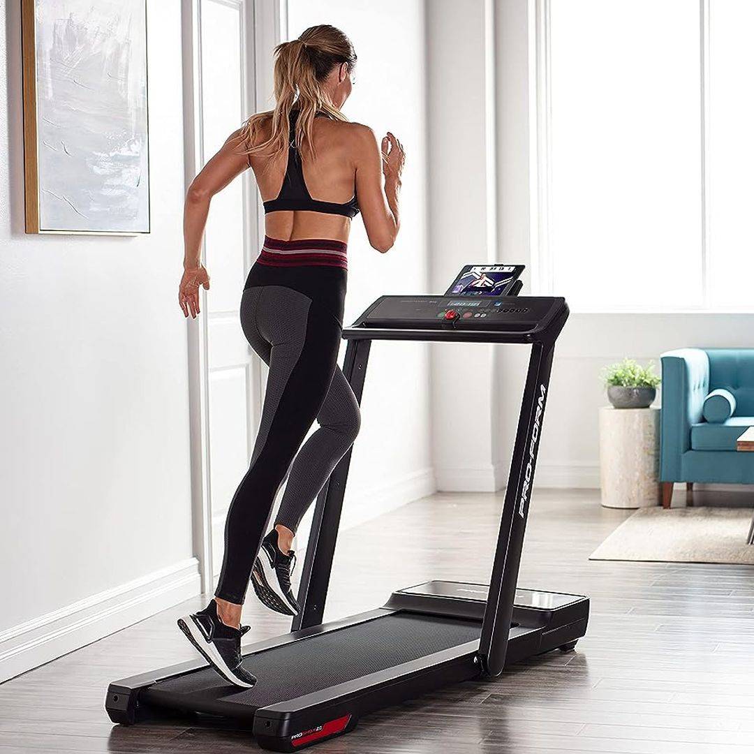 female athlete running on proform city l6 treadmill