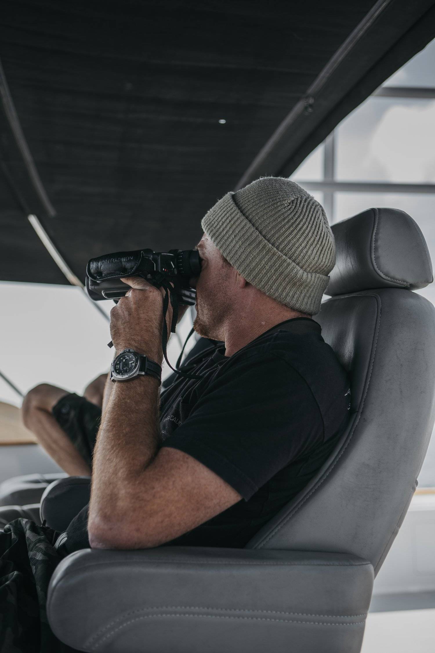 An image of Thos Carson on his boat looking for swordfish.