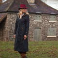 Navy Fernley long coat with hat in countryside