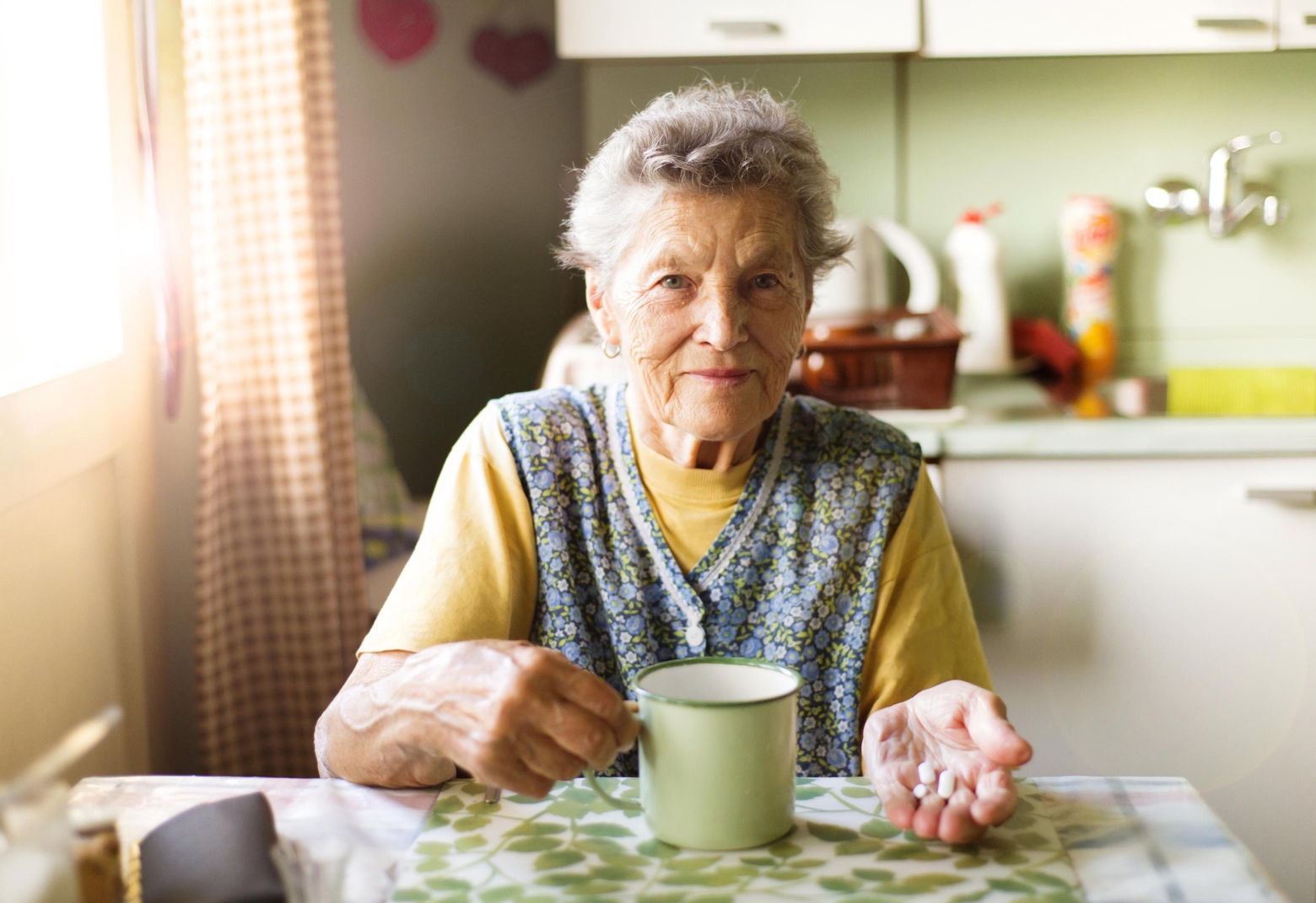 Old Woman Taking Pills 