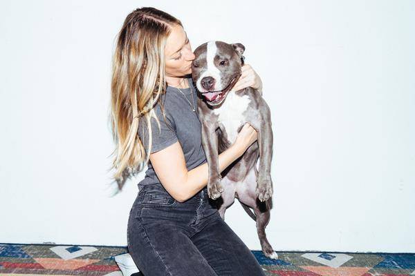 A dope dog being shown motherly affection by its owner!