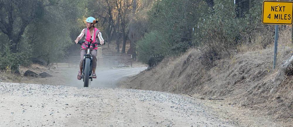 a woman on an aventon aventure electric bike during a tour with yosemite e-biking (yosemiteebiking.com) in the sierra foothills