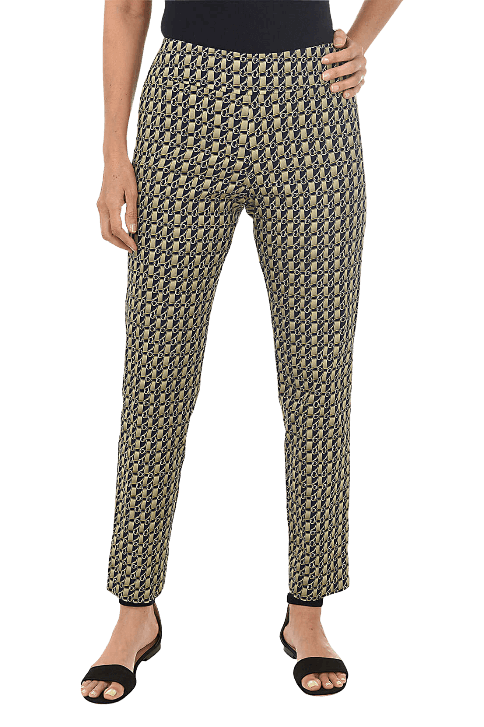 A woman wearing a printed ankle pant against a pink background