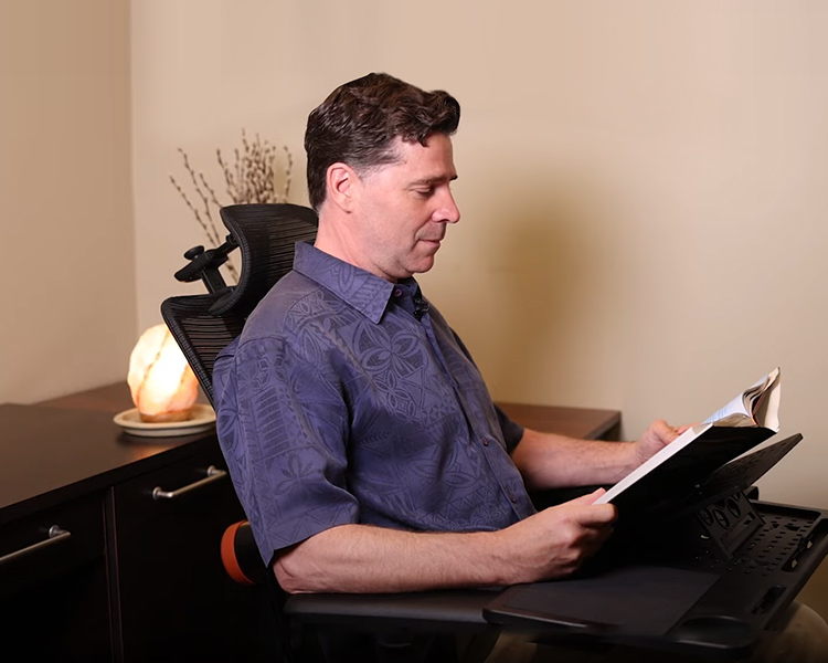DR Kevin MorganChiropractor sits on the newtral magic h chair