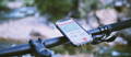 Close up of bicycle handlebars and Strava app