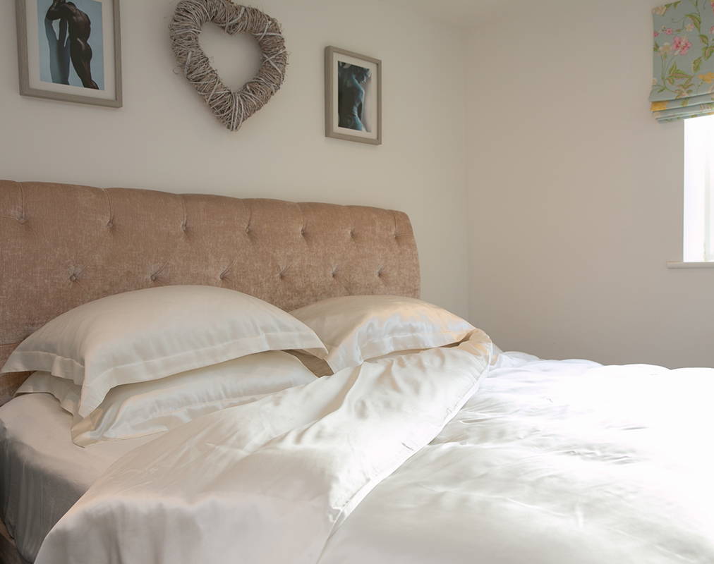 silk bed set with the corner of the duvet cover folded back