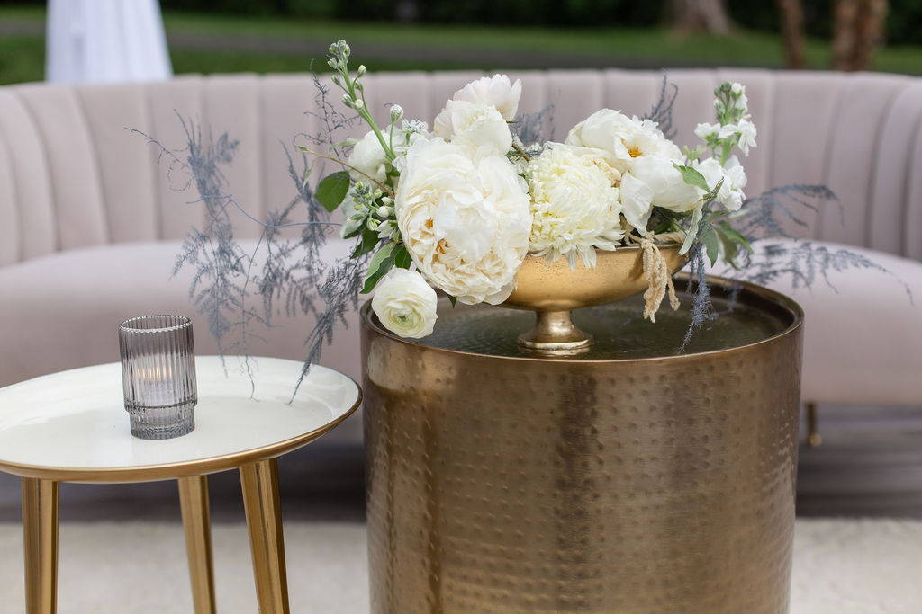 White centerpiece on gold side table