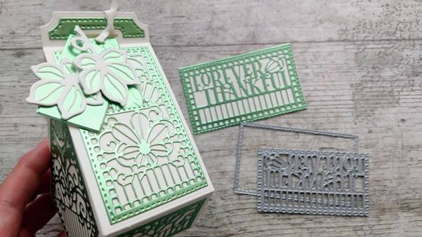 a box with a green and white design